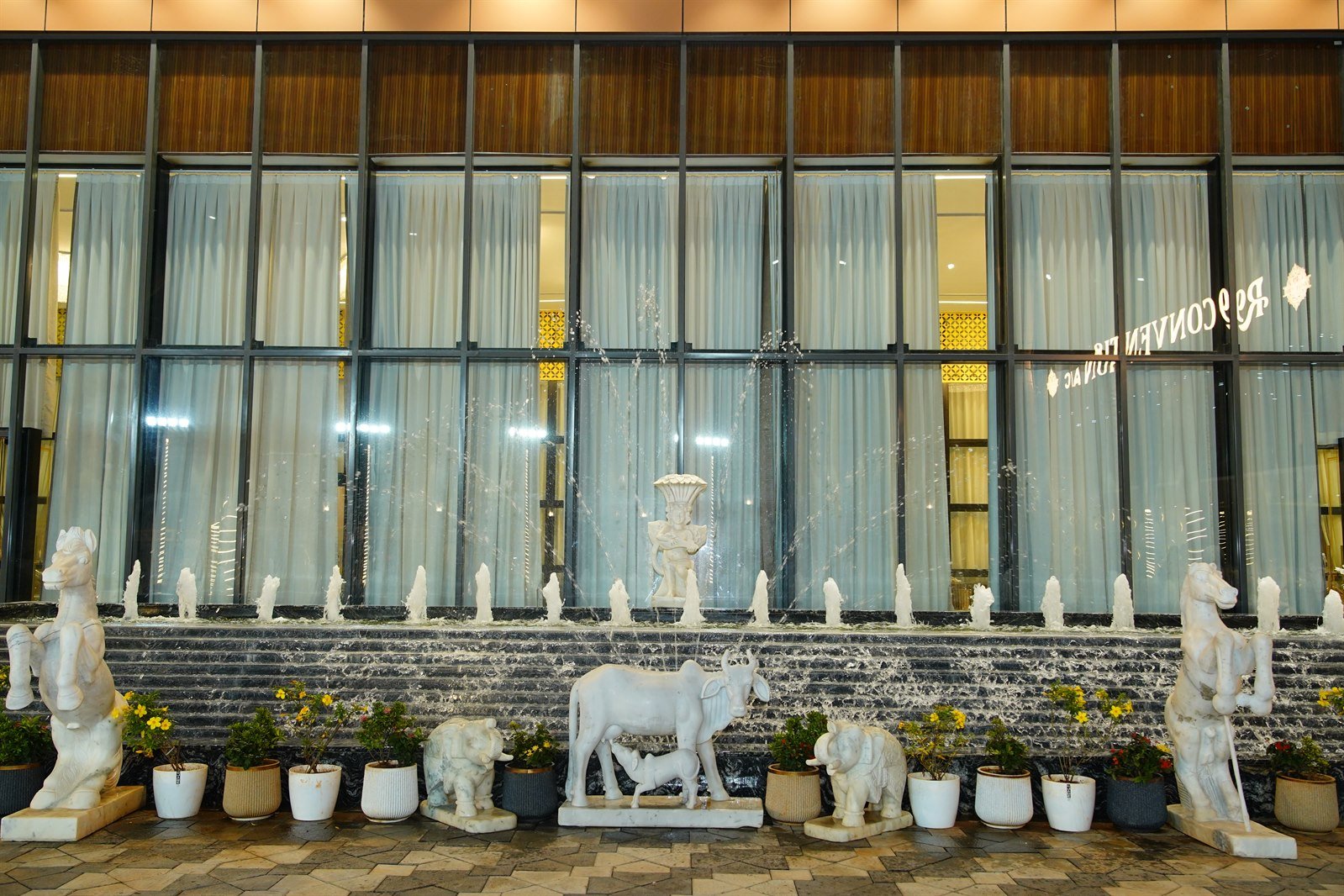 SDR R9 Convention daytime exterior facade with courtyard and sculptures