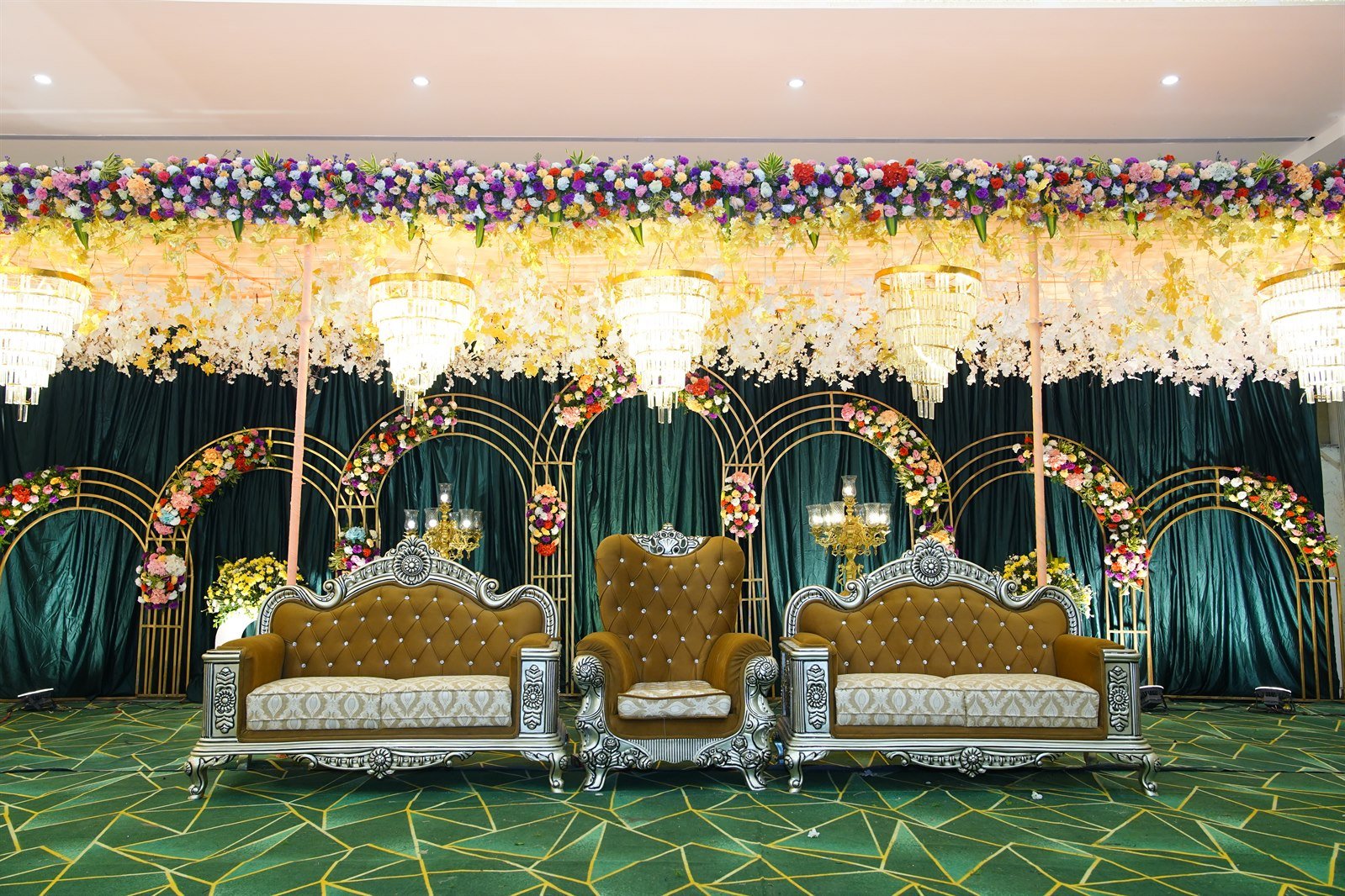 Emerald and Gold Reception Stage Setup at R9 Convention